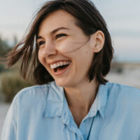 smiling portrait of candid laughing woman